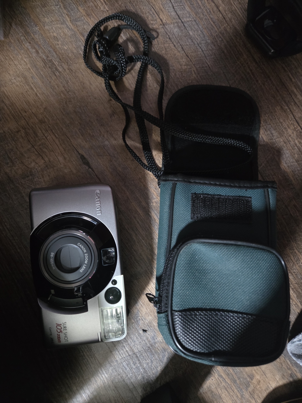 Canon Silver Point-and-Shoot Camera with Teal and Black Carry Pouch
